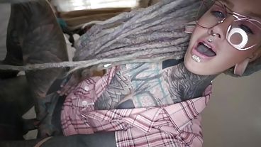 Tattooed and freaky-looking lady worships cock and gets fucked anally